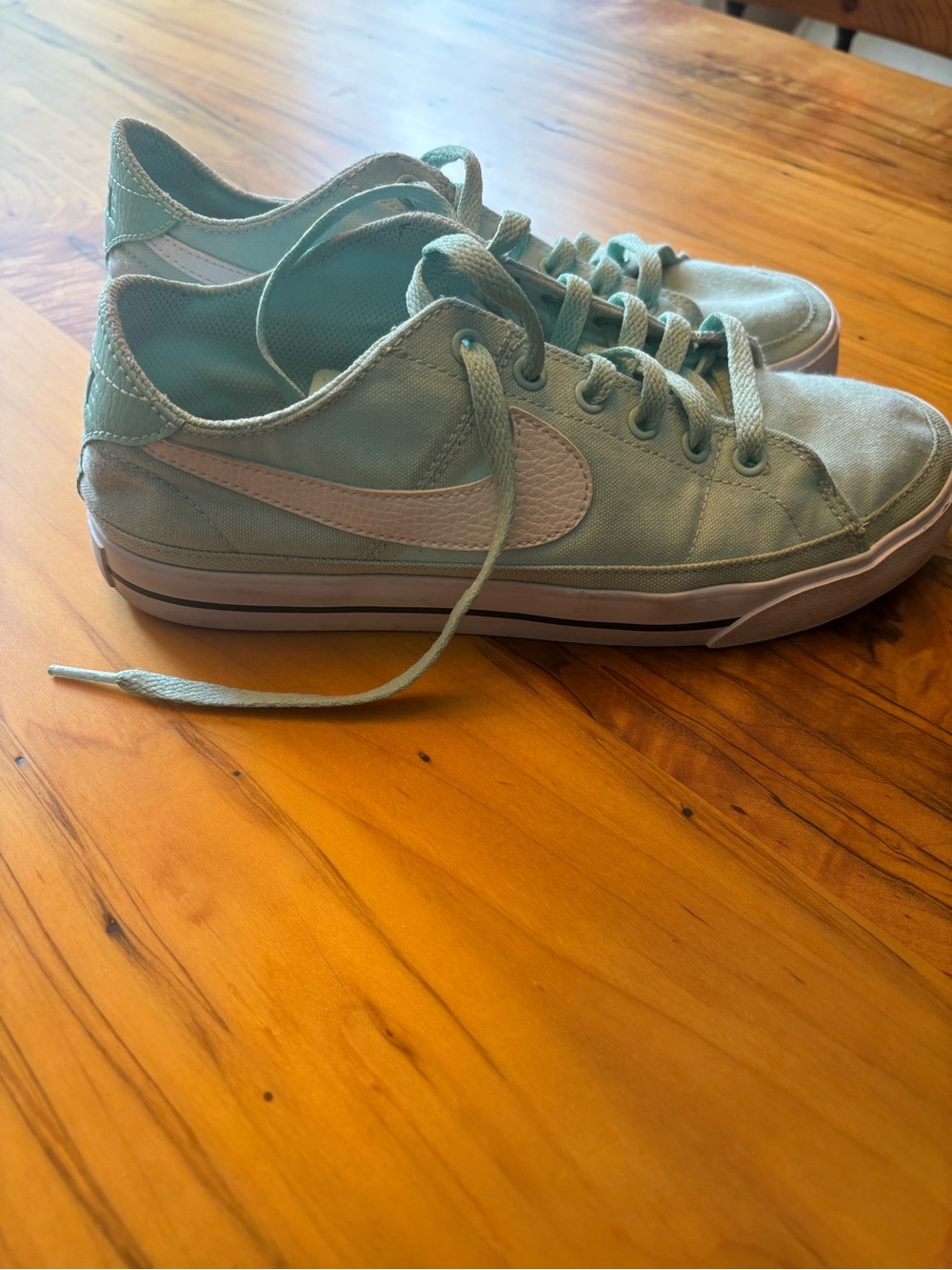 Nike Women's Low-Top Sneakers in light blue with White Swoosh